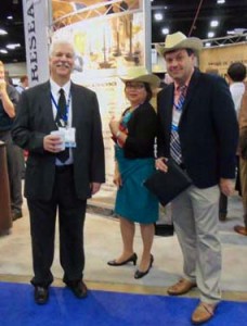 Bill Schachtner and Magdalena Mejillano of PPD and Brent Donovan of Merck enjoy cowboy cocktail hour at the Bend Research booth